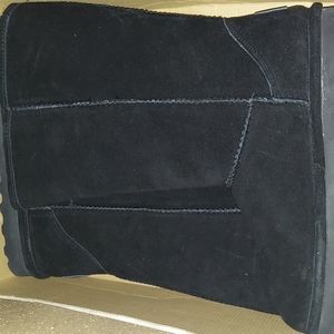 Size 11 Bearpaw boots. Long in height. Brand new in box.